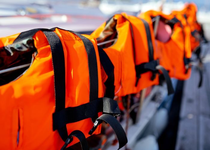 a few bright orange life jackets