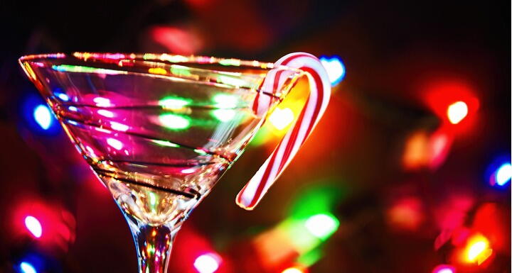 Martini glass with holiday lights and candy cane