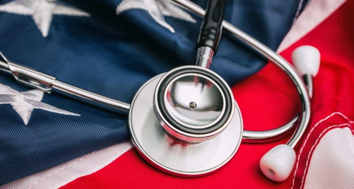 Stethoscope lying on top of American flag